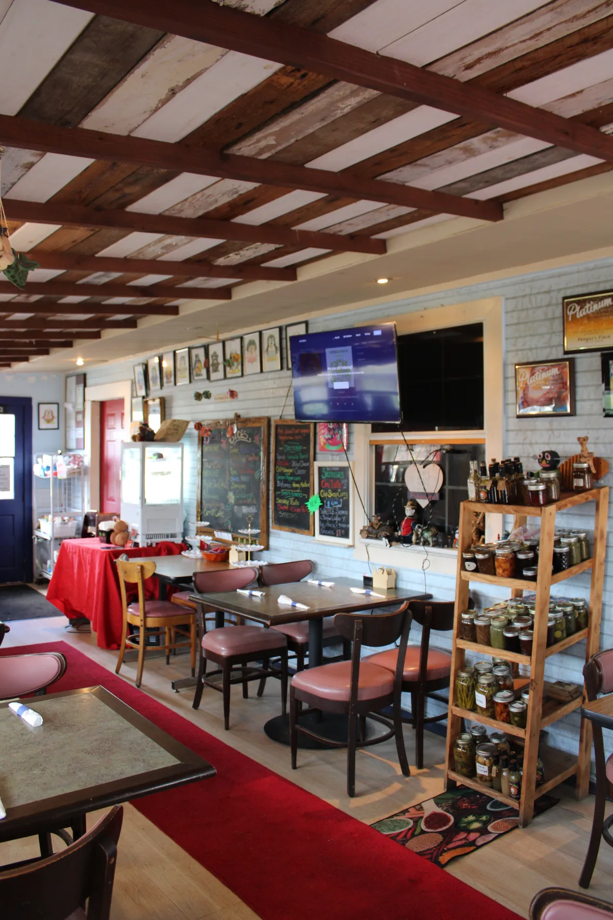 The cozy beamed dining room at Pengus's Place